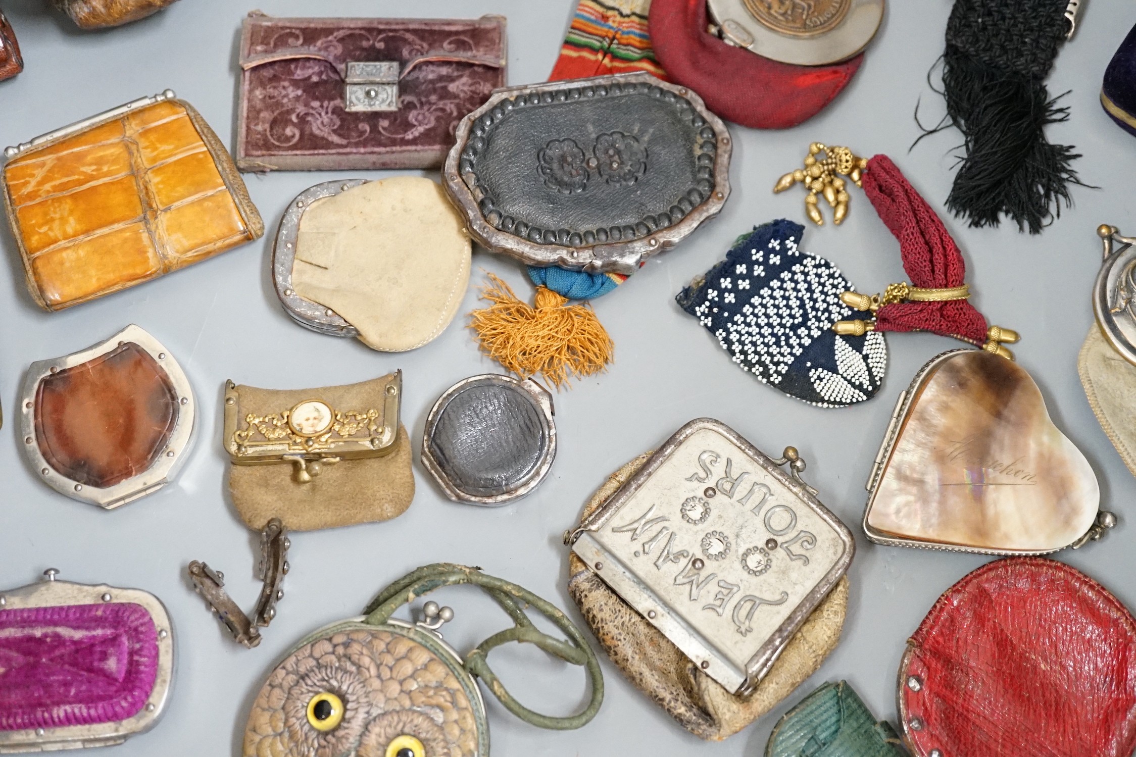 Mixed collection of mainly 19th century leather purses of various sizes and shapes, including two novelty ‘owl’ purses, a horse shoe shaped silver framed purse, cut steel purses, approx 39 in total